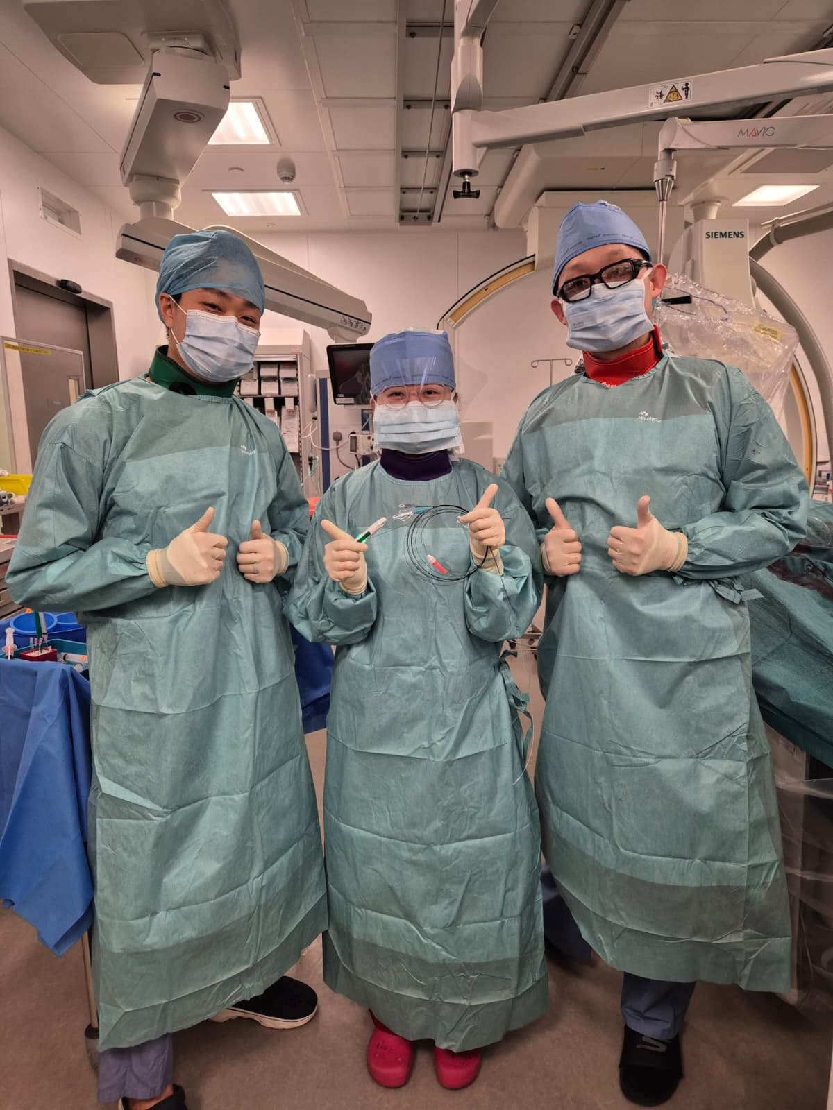 Dr Andy Sukmadja with cath lab team Singapore